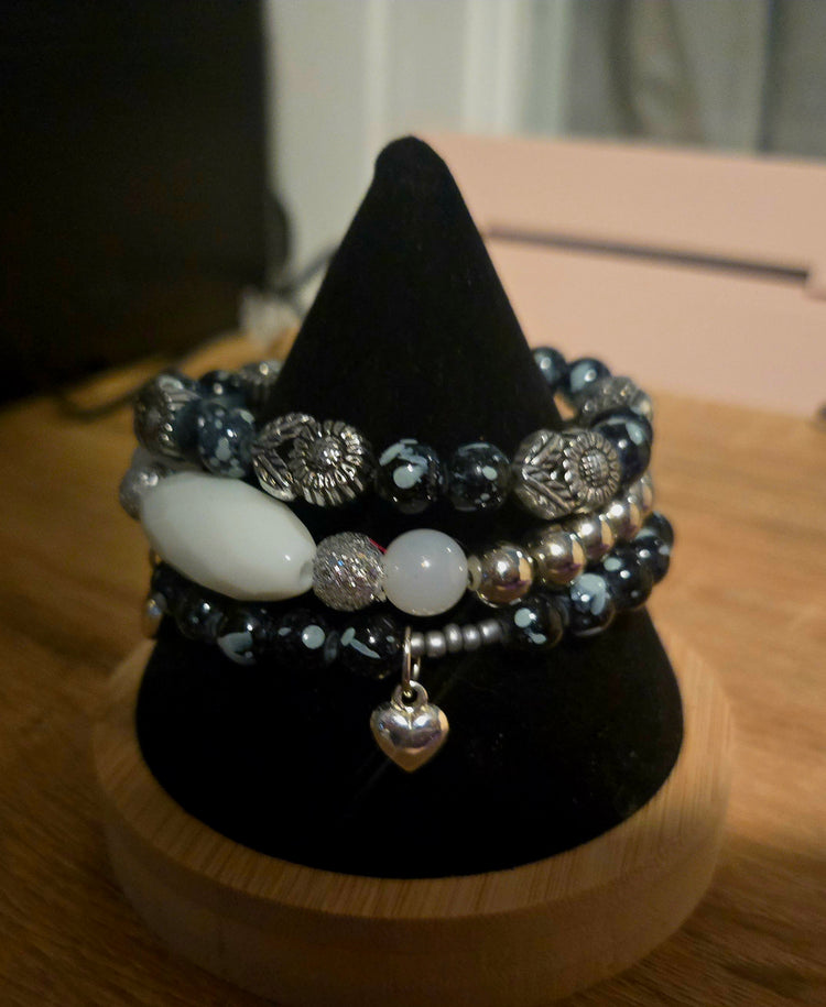 Black beaded 3 bracelet set with silver flowers beads and silver heart charms