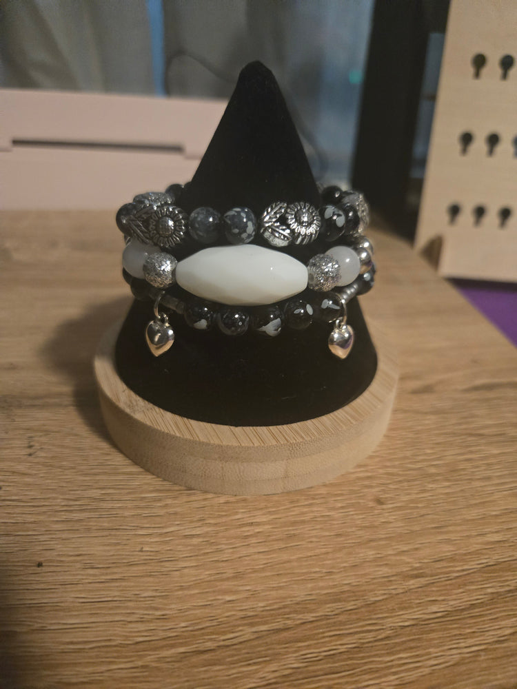 Black beaded 3 bracelet set with silver flowers beads and silver heart charms
