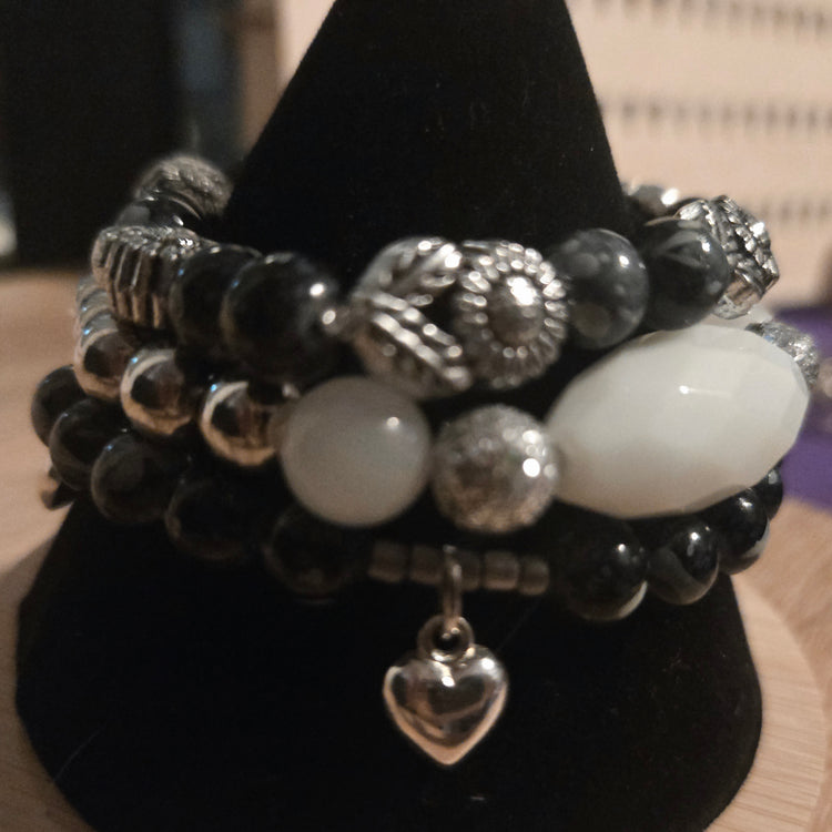 Black beaded 3 bracelet set with silver flowers beads and silver heart charms
