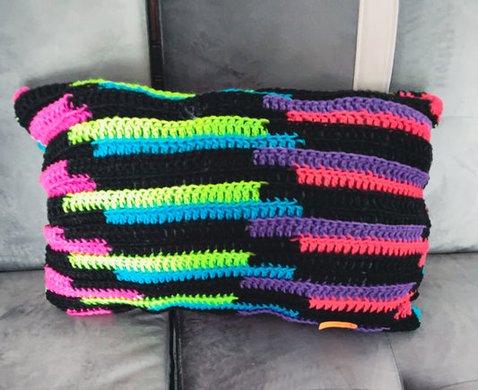 Crocheted multi colored pillow