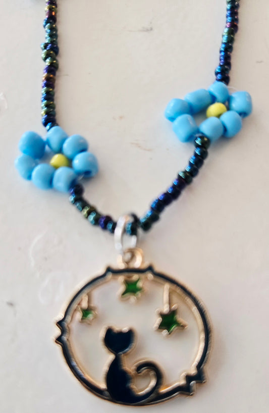 Rope style blue daisy chain featuring a Cat Moon pendant