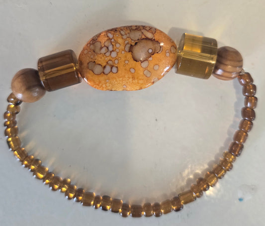Boho chic orange and brown beaded bracelet