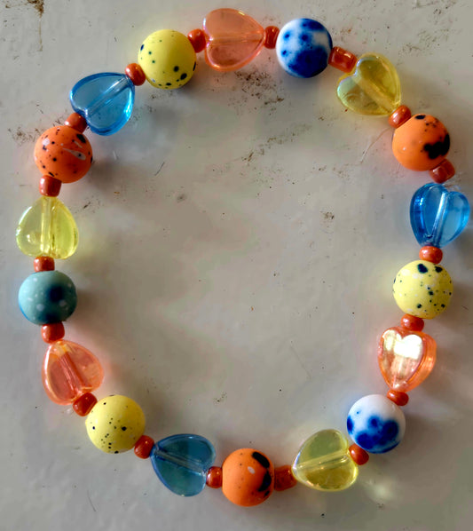 Tie dyed orange, blue and yellow heart beaded bracelet