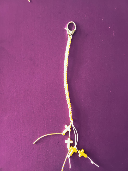 Yellow and white macrame cross keychain