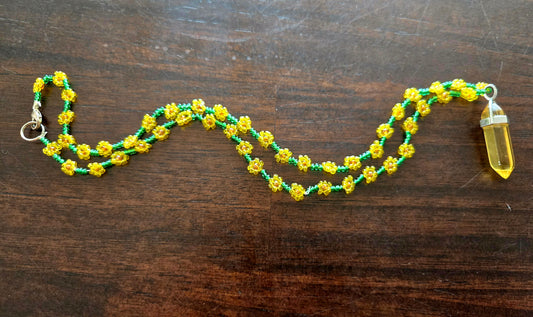 Sunflower colored rope style daisy chain with crystal pendant